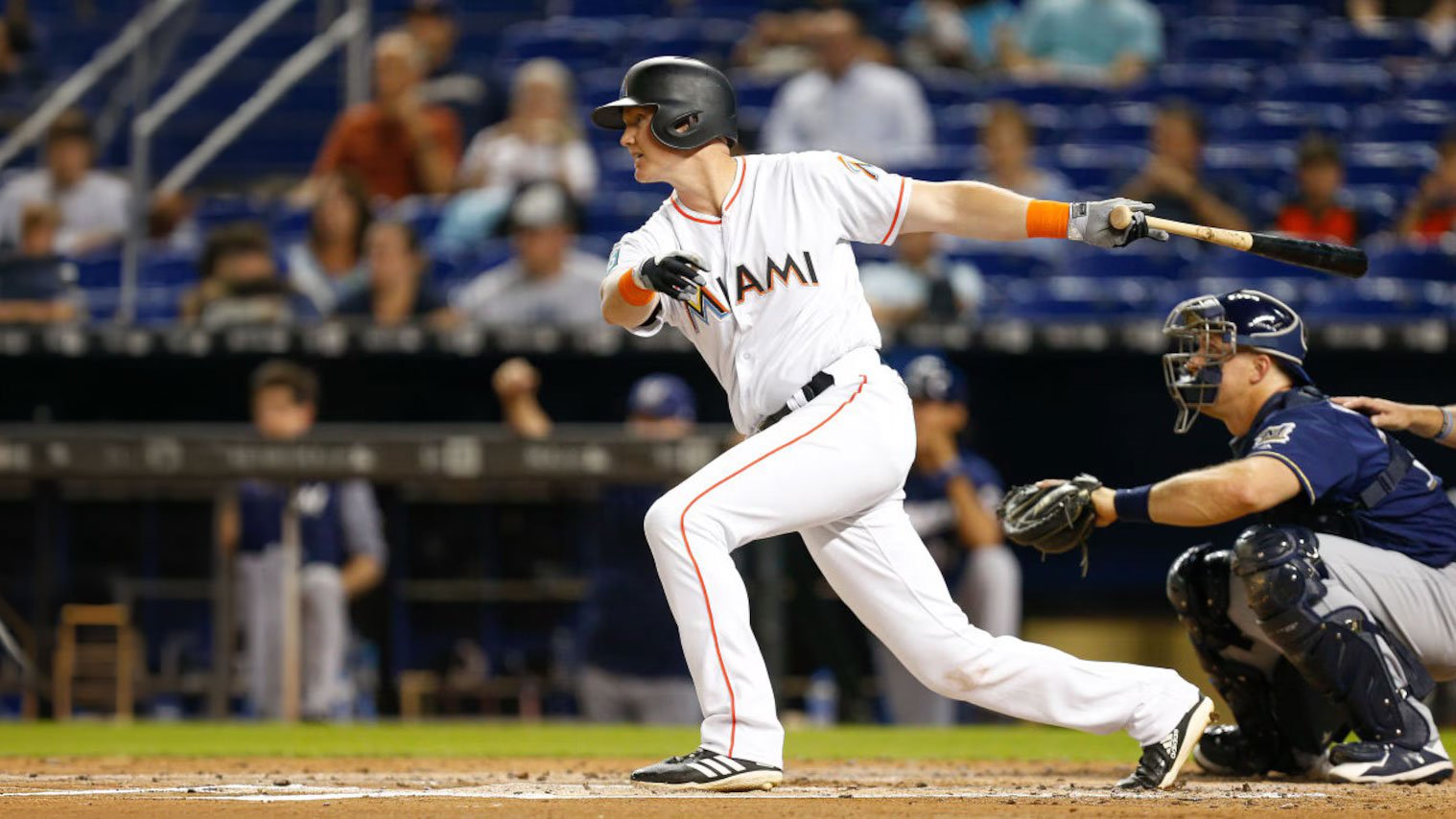 Garrett Cooper swinging a bat during an MLB game