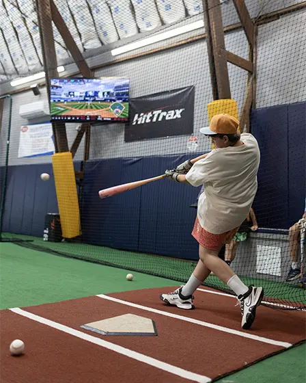 Batter training in a HitTrax cage
